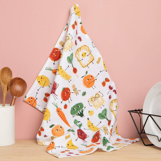Kitchen towel with cartoon food pattern hanging on a pink wall