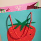 close up of giant strawberry gift bag 