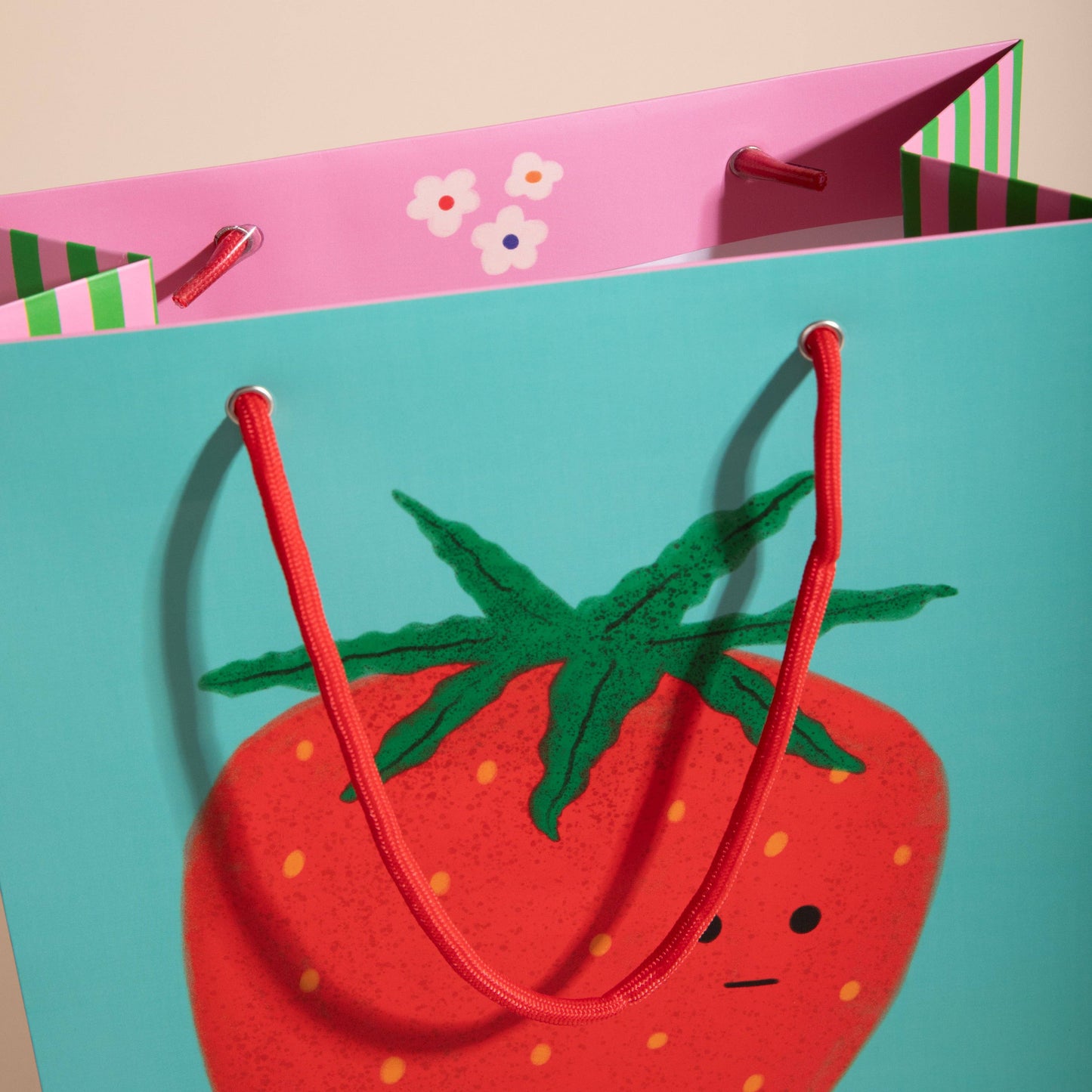 close up of giant strawberry gift bag 