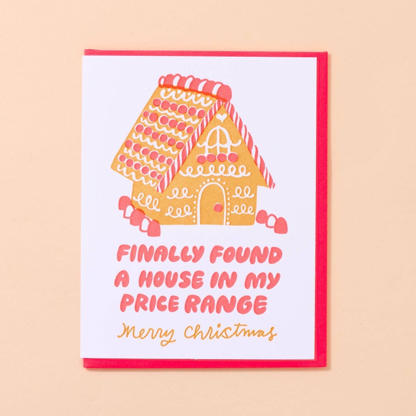 holiday greeting card with a decorated gingerbread house on it. Text reads "Finally found a house in my price range. Merry Christmas" 