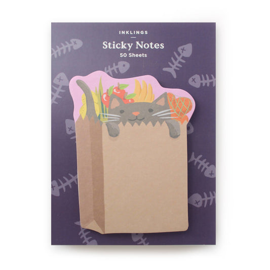 Stack of sticky notes with design of a cat inside a grocery bag 