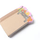 Stack of sticky notes with design of a cat inside a grocery bag 