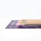 Stack of colorful sticky notes on a purple pad with a white background