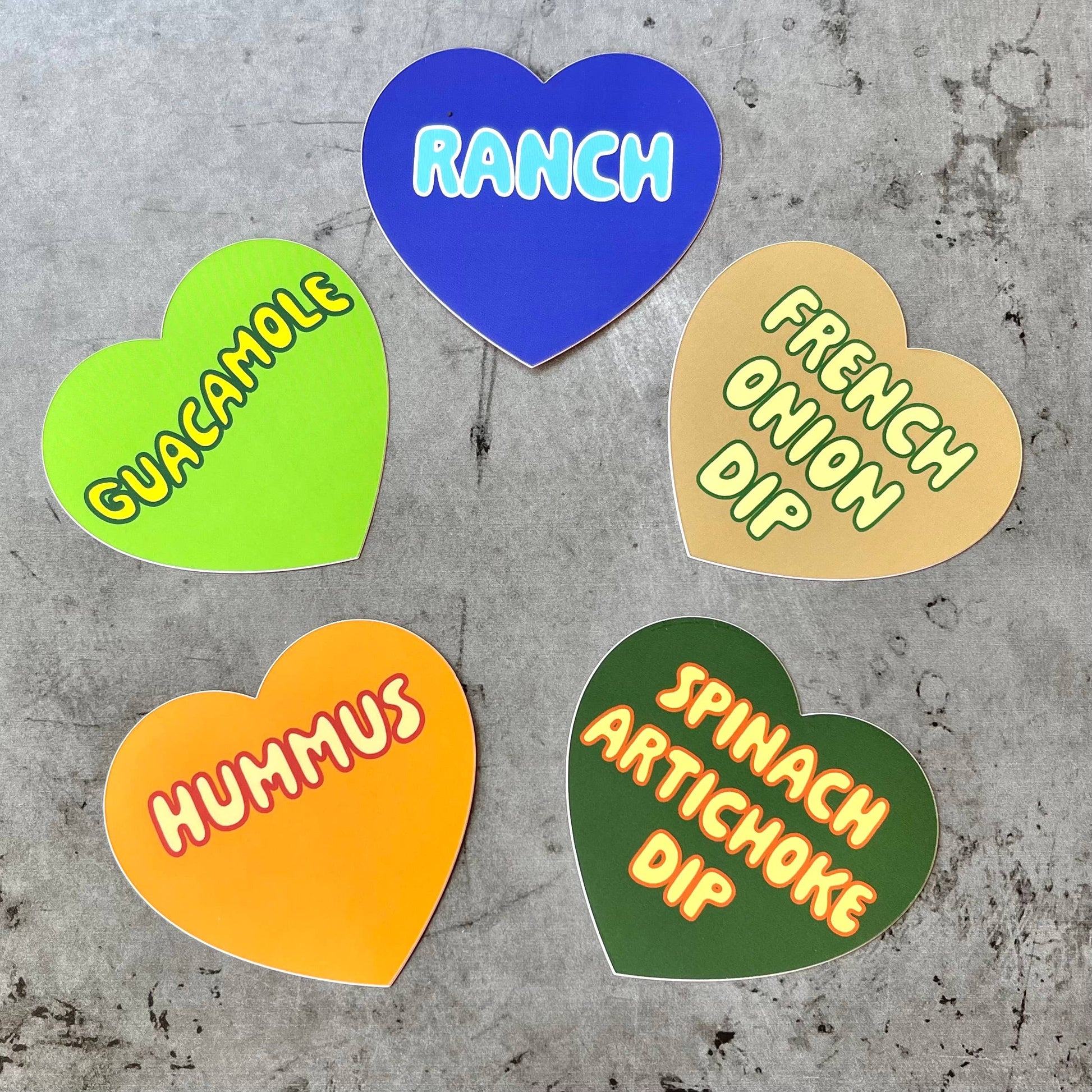 Several different heart shaped stickers in different colors. Types read: ranch, french onion dip, guacamole, spinach artichoke dip, hummus