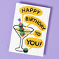 Birthday card with a martini glass and olives on a purple background