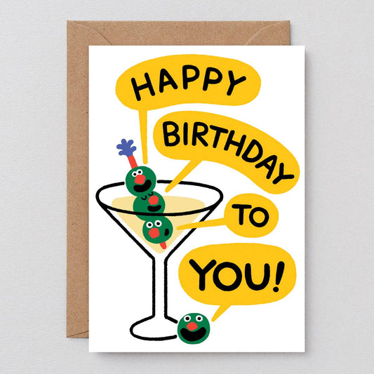 Birthday card with a martini glass and olives on a gray background