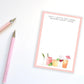 Before Happy Hour Notepad shown with two pink pens.