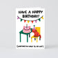 birthday card with image of cat wearing a party hat and a cat shaped cake on the table