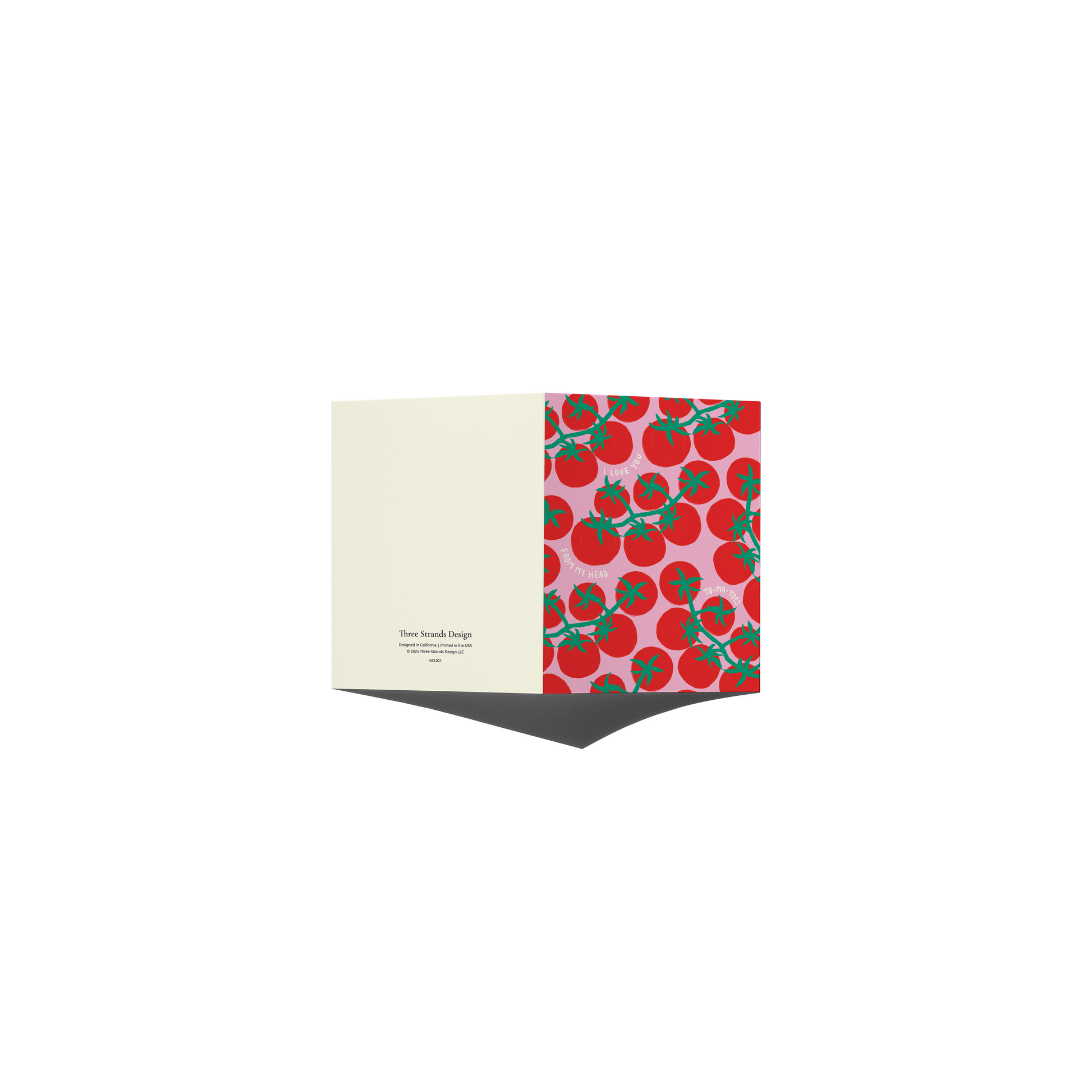 A folded greeting card shown open against a plain white background. The left panel is a warm cream color with small black text, and the right panel features a repeating pattern of red tomatoes with green stems on a light pink background.