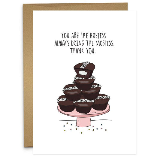 greeting card that reads "You are the hostess always doing the mostess. Thank you." and has a pyramid pile up of hostess cupcakes on a cake stand