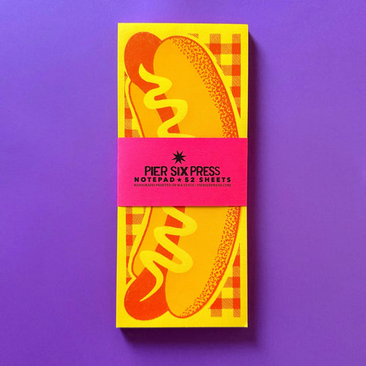 Notepad with colorful design on a purple background