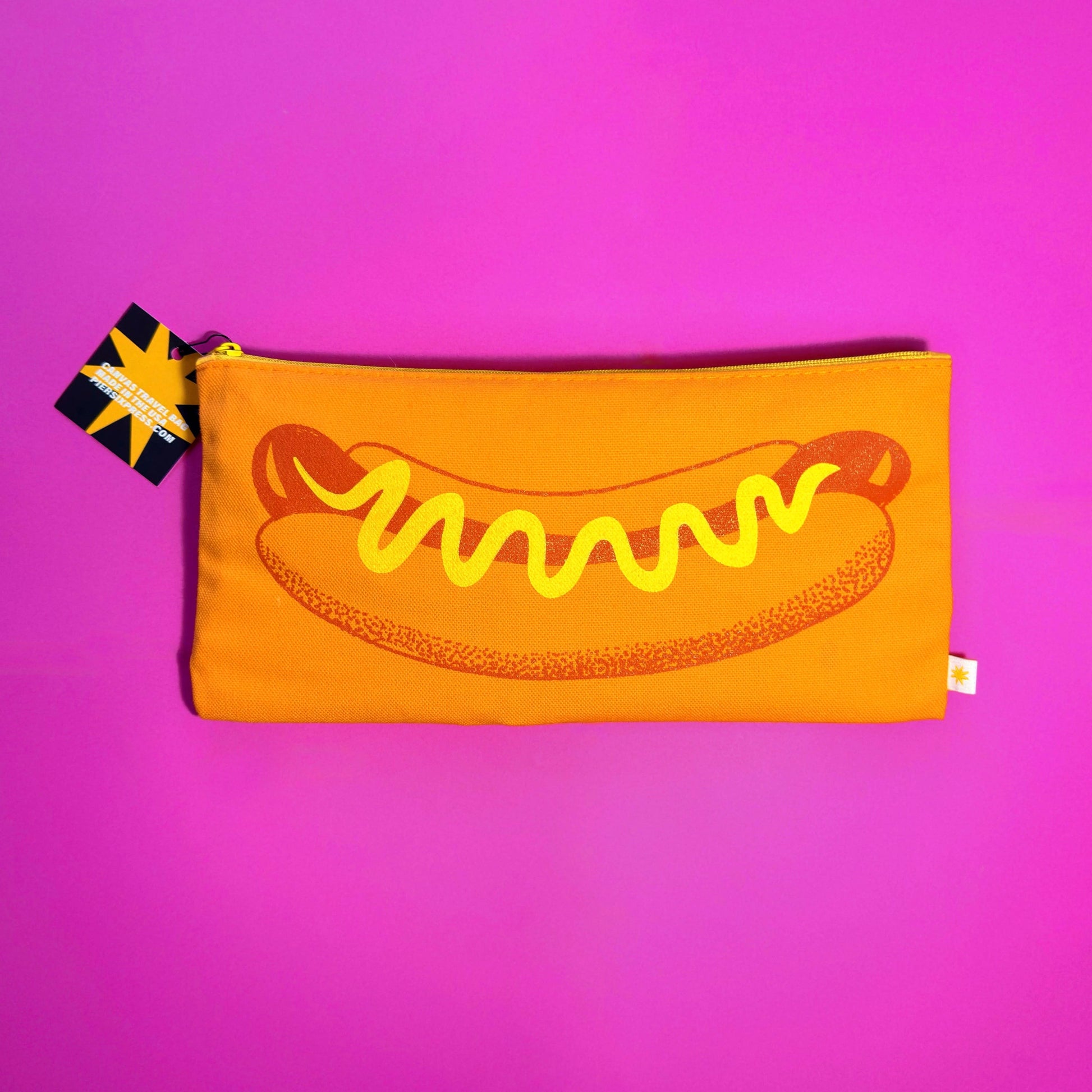 Pouch with hot dog design on a pink background