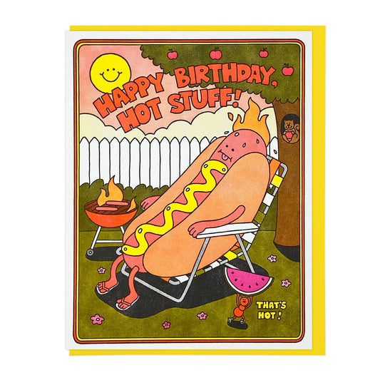 birthday card with a hot dog grilling and also sitting in a lawn chair, burning in the heat. text reads "happy birthday hot stuff" 