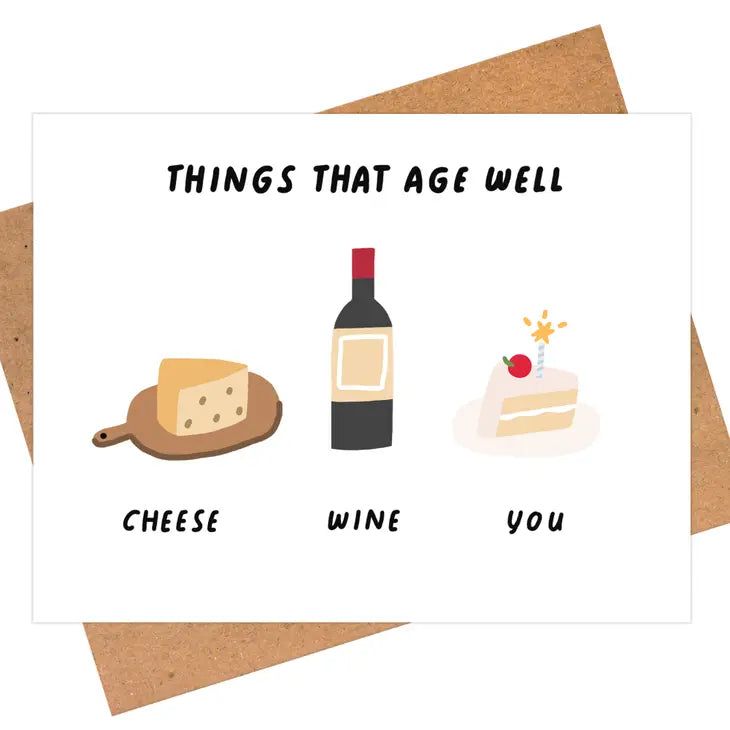 Greeting card that reads "Things that age well: Cheese, Wine, You" and has illustrations of cheese, wine and a slice of cake with a cherry and candle on top 