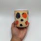 Ceramic tumbler adorned with hand painted mixed berries.