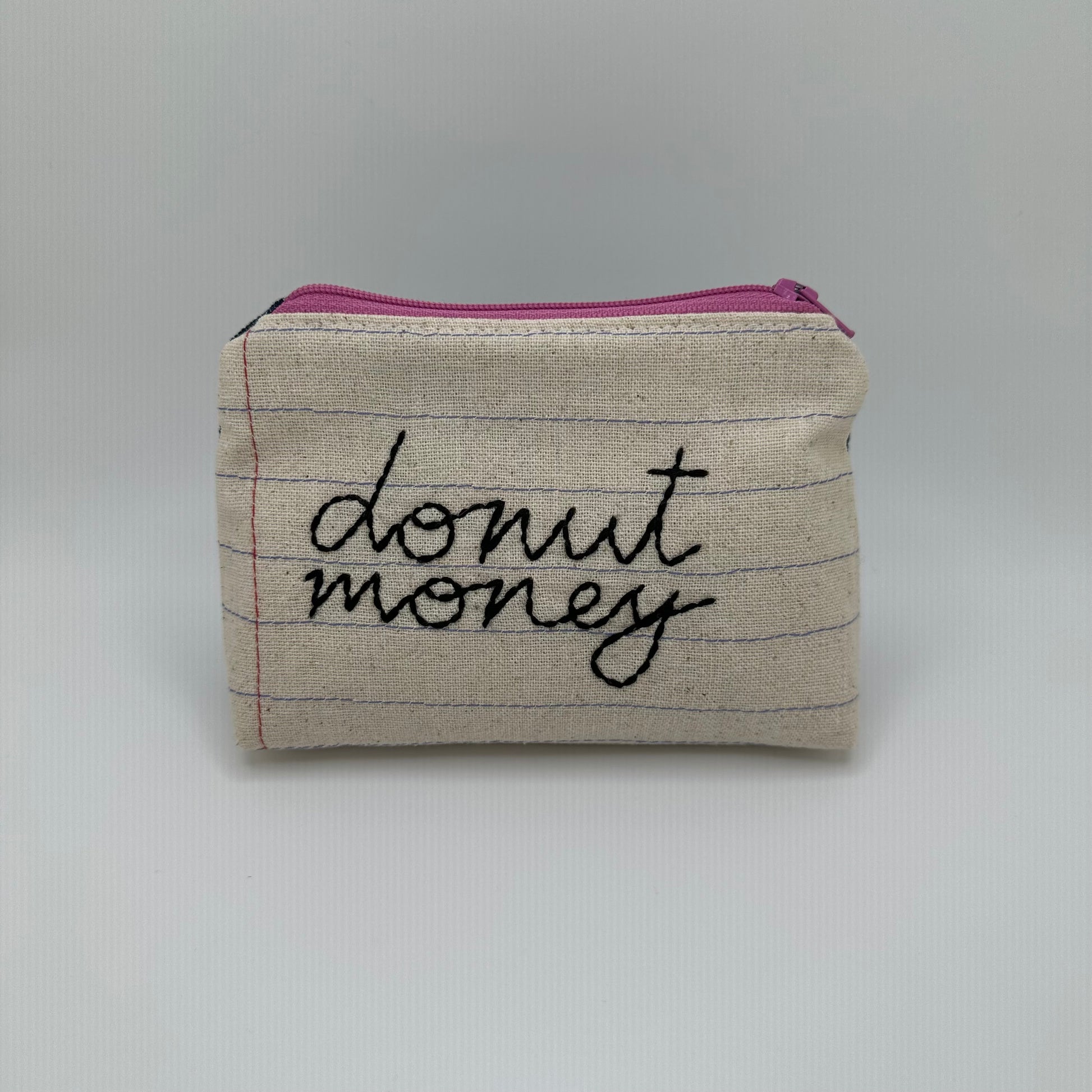 Handmade pouch sewn with the words "donut money"