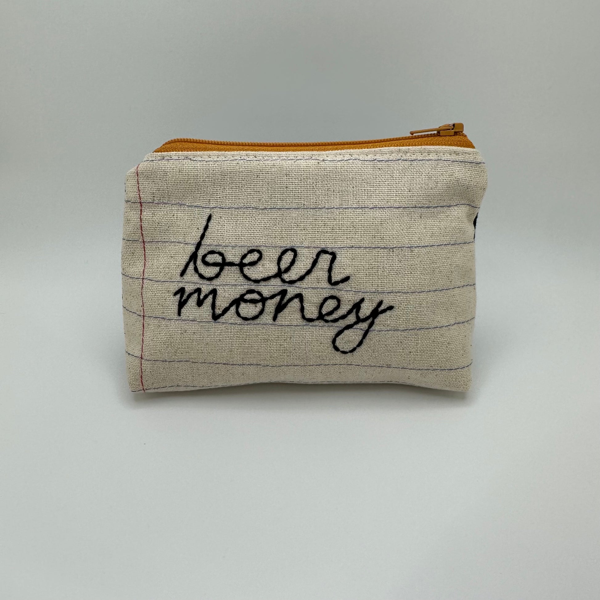 Handmade pouch sewn with the words "beer money"