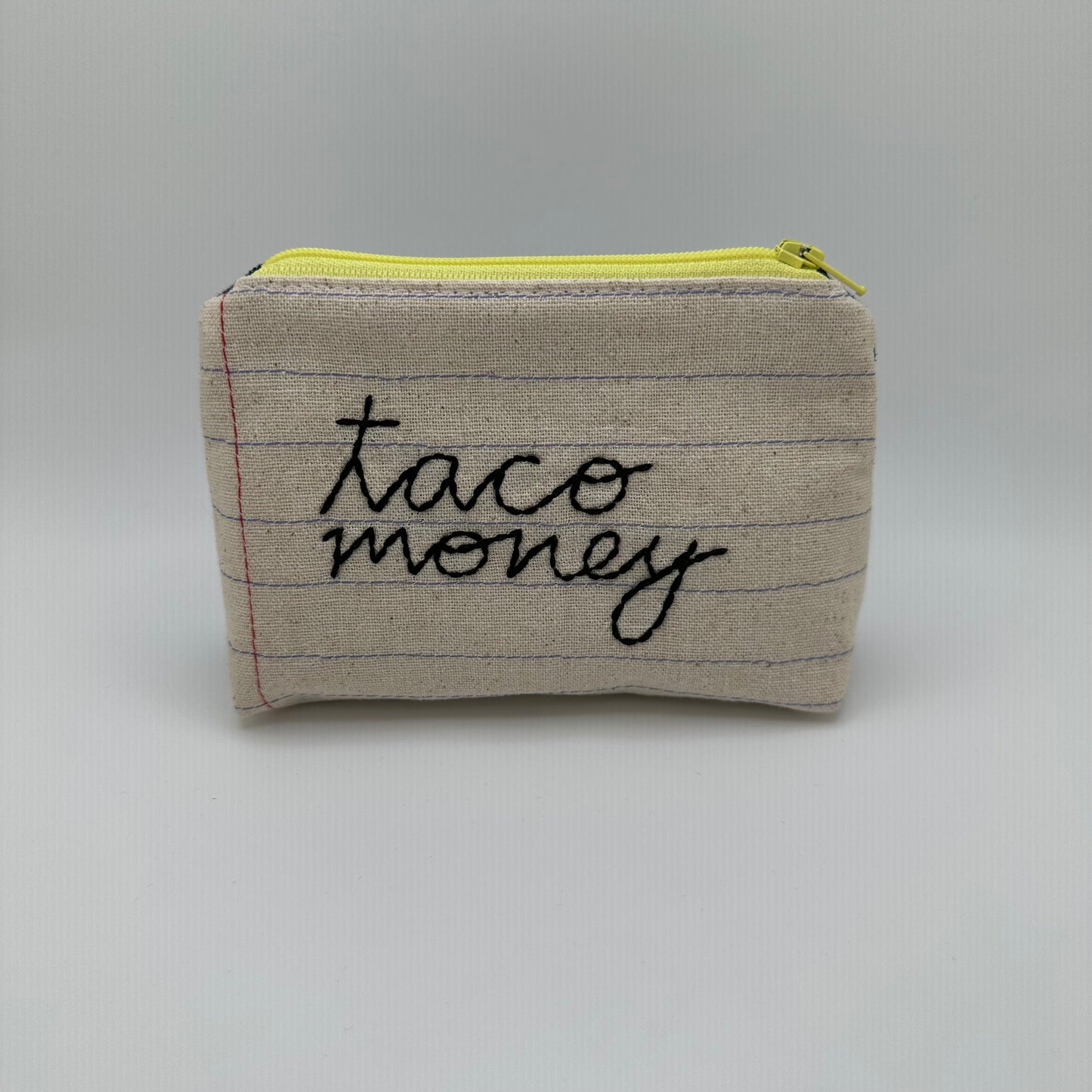 Handmade pouch sewn with the words "taco money"