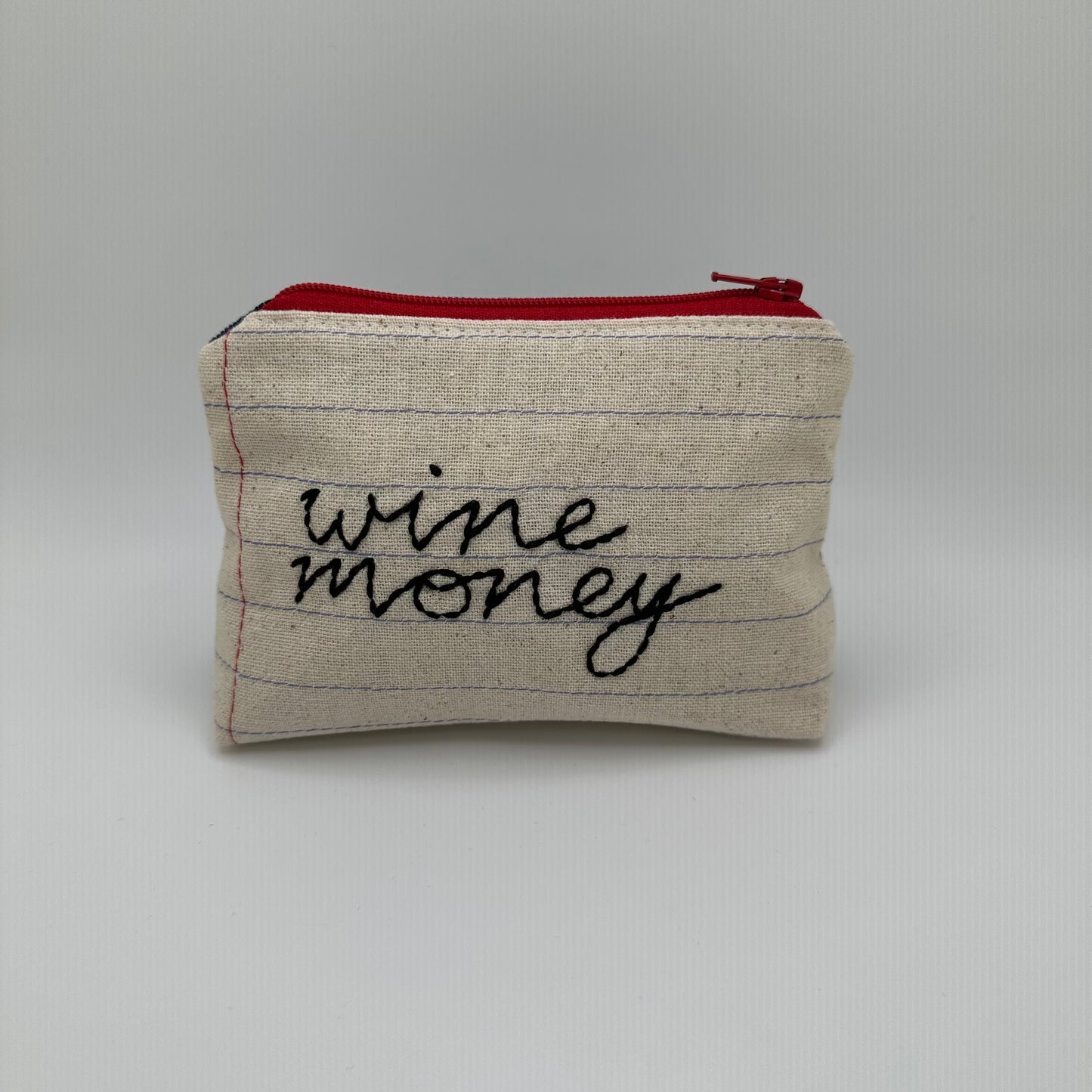Handmade pouch sewn with the words "wine money"