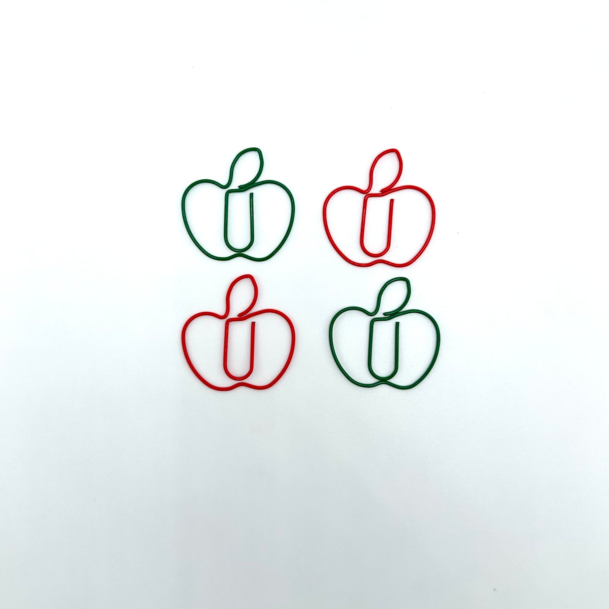 4 paperclips in the shape of apples. 2 red and 2 green.