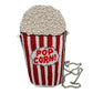 Beaded purse meant to look like a striped popcorn canister with overflowing popcorn. Showing chain strap detailing.