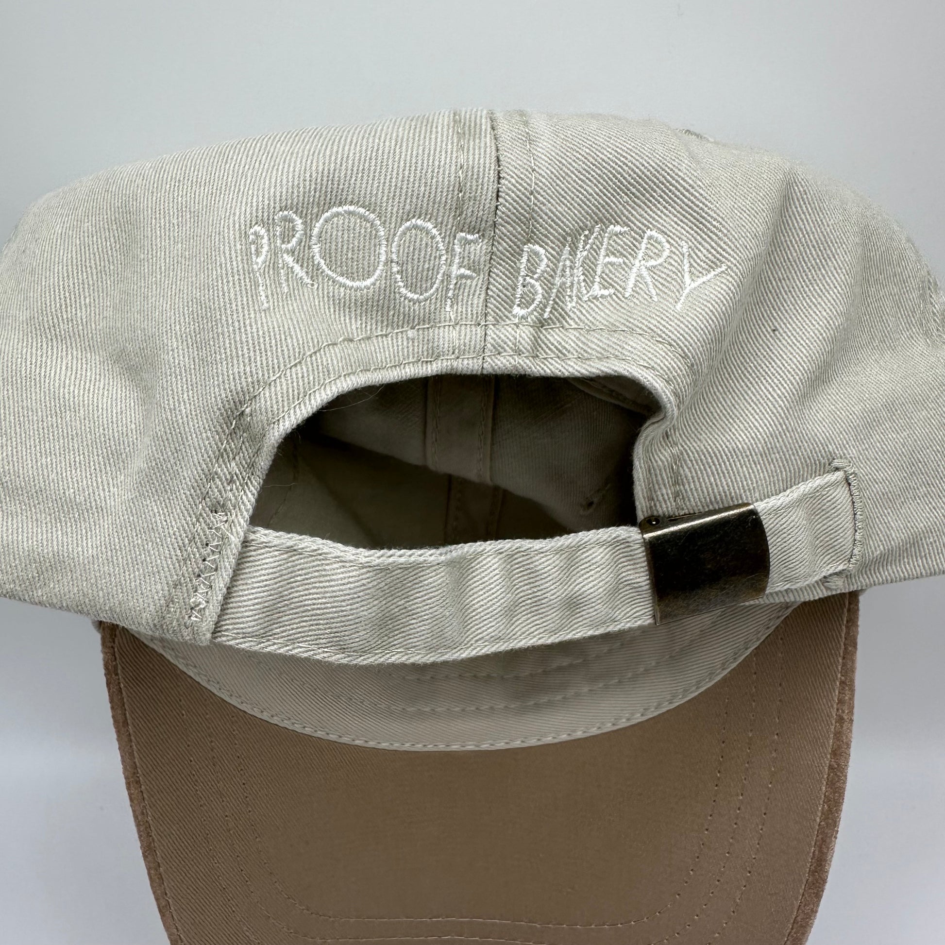 Back of hat with words: Proof Bakery