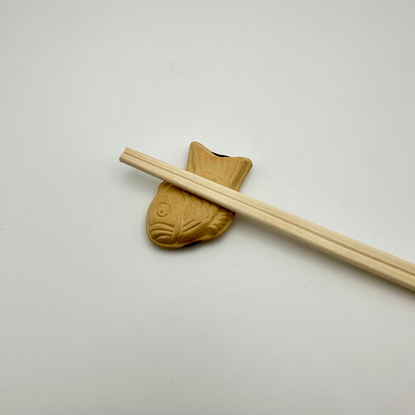 Taiyaki choptick holders with chopsticks.