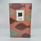 Mauve notebook with teal and brown flounder swimming. Japanese words that read "hirame."