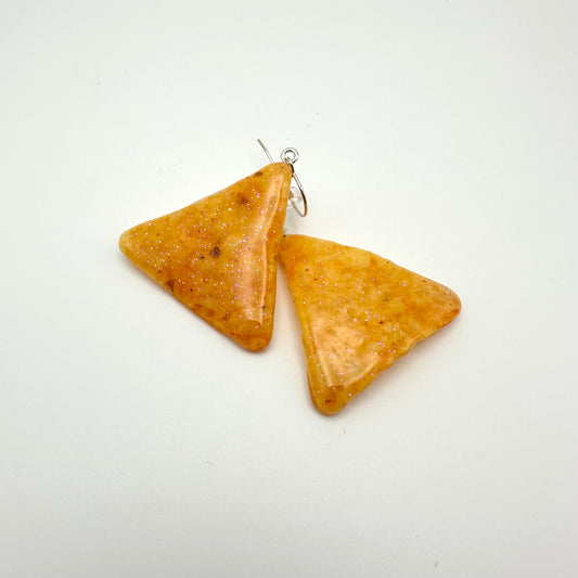 Tortilla chip earrings dipped in resin with hook earrings.