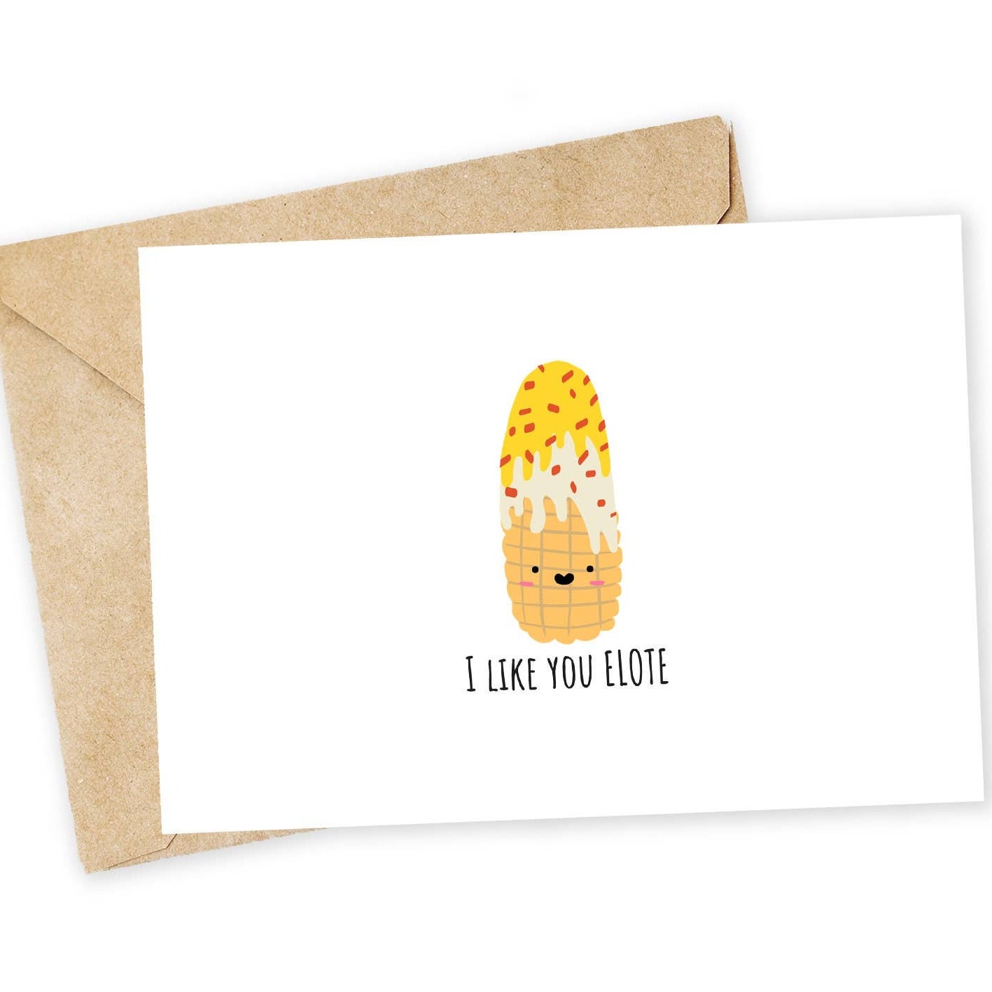 Greeting card with a corn illustration and text that says "I like you elote" with envelope on a white background