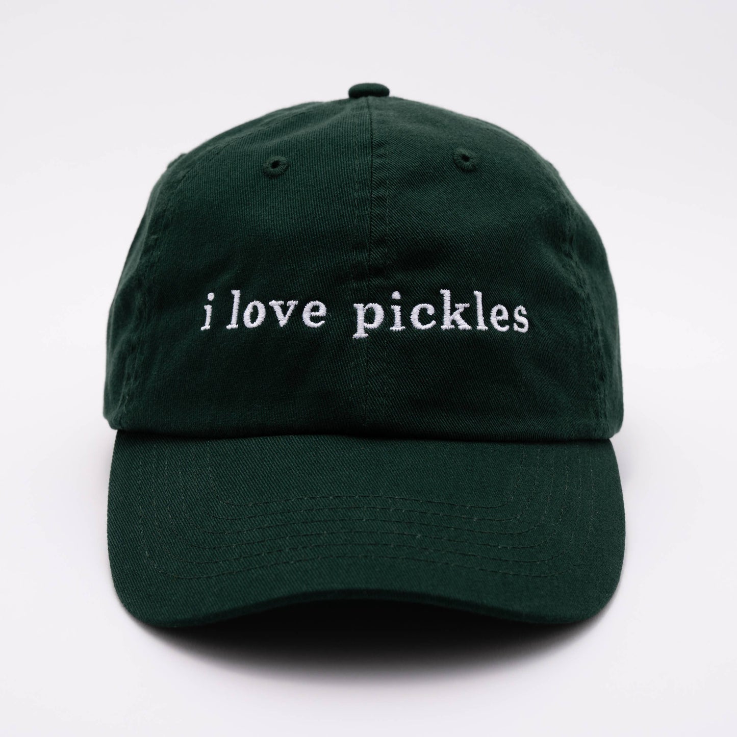 Green cap with 'i love pickles' text on a white background