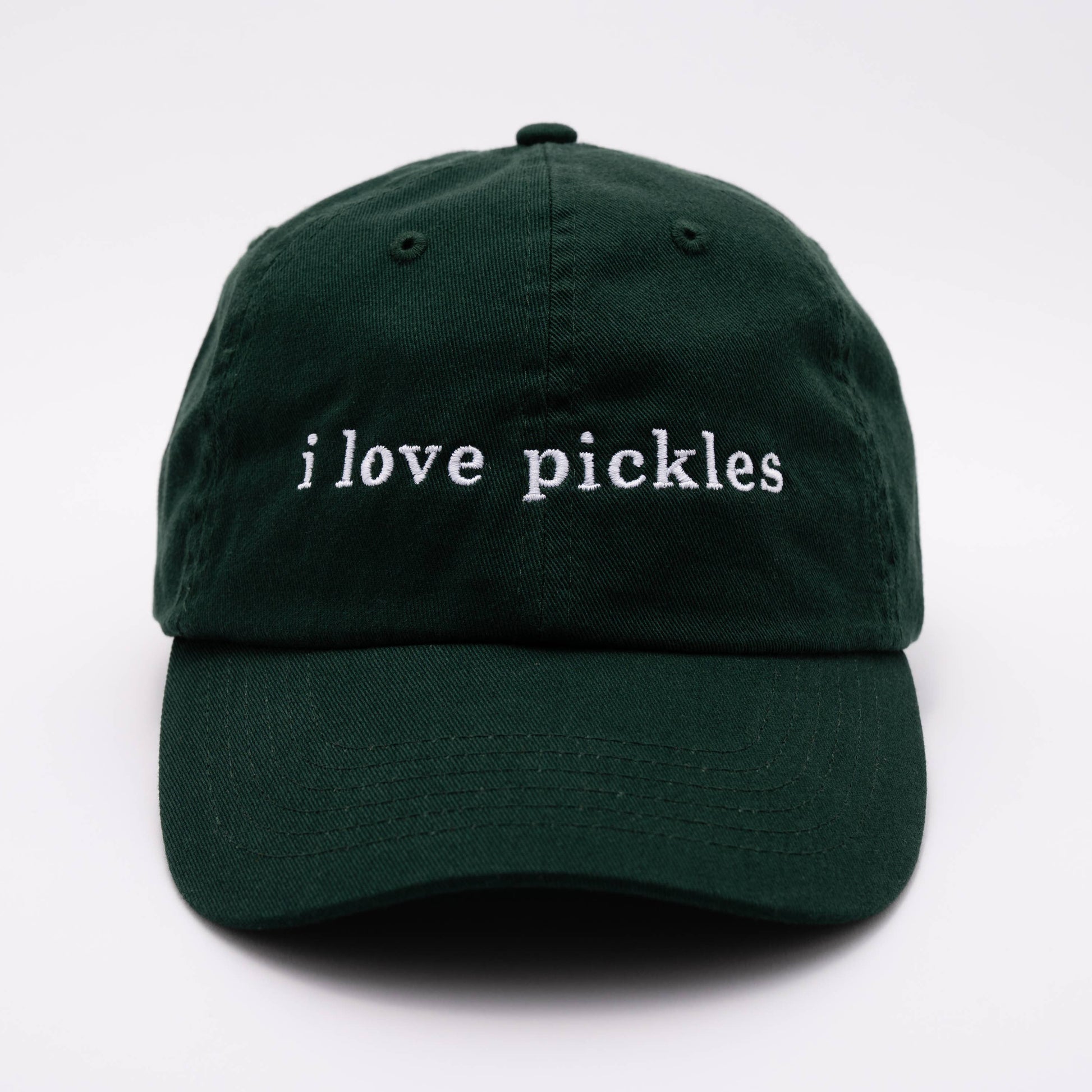 Green cap with 'i love pickles' text on a white background