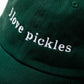 Green cap with 'i love pickles' text on a white background