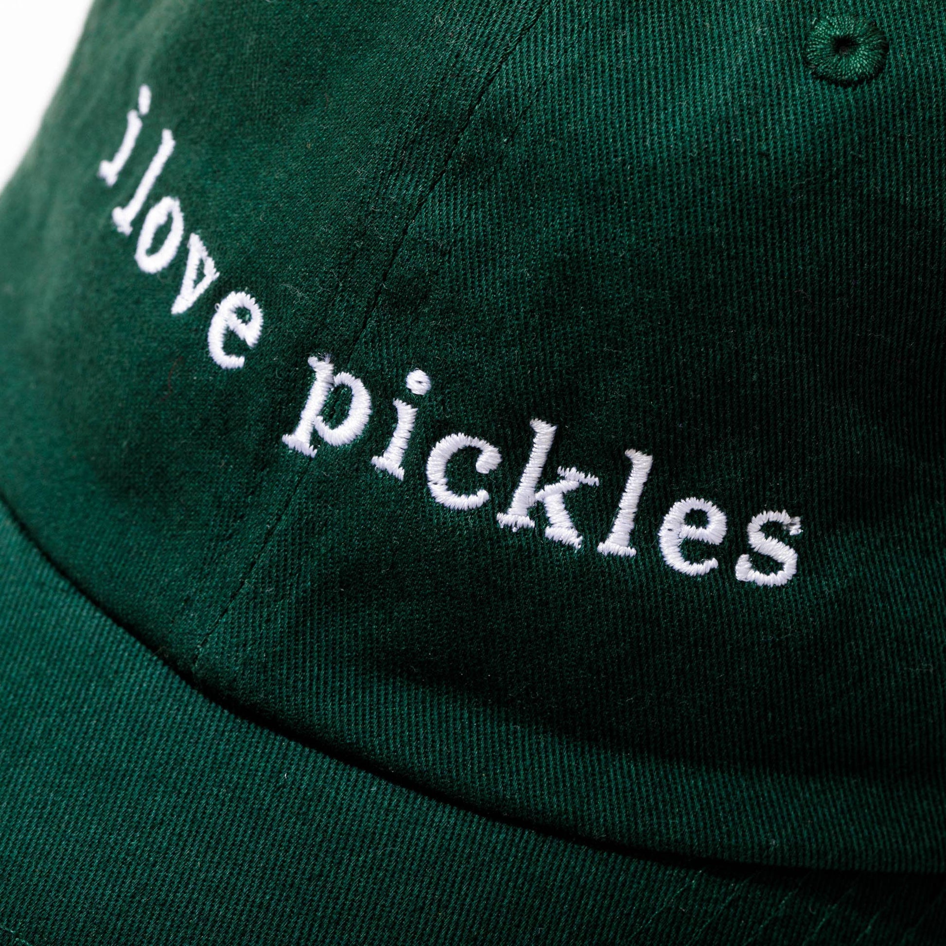 Green cap with 'i love pickles' text on a white background