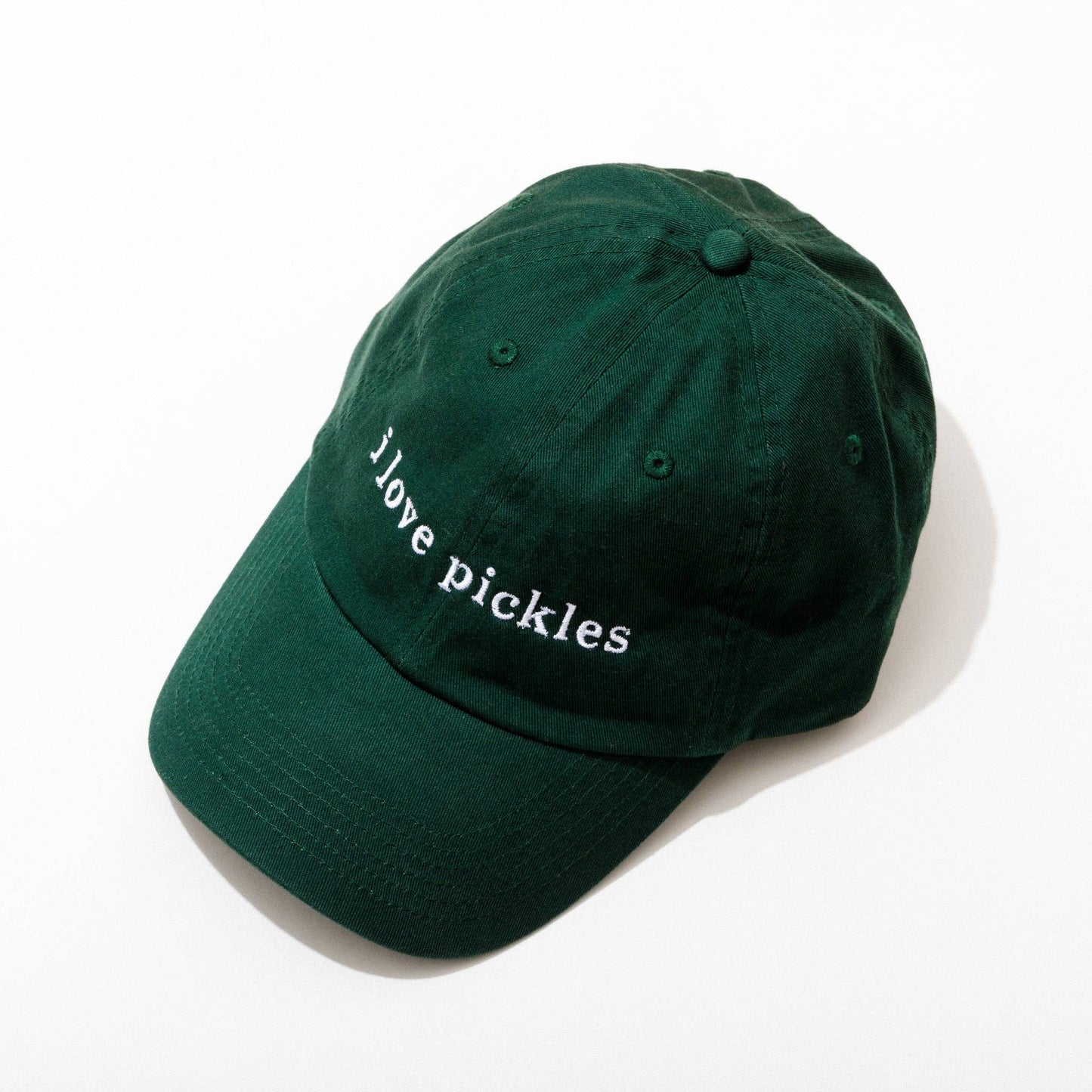 Green cap with 'I love pickles' text on a white background