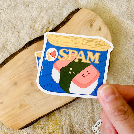 Sticker with a spam can illustration on it. Text reads "I <3 spam" 