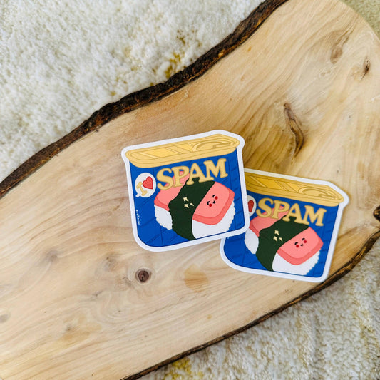 Two "I <3 spam" stickers on plank of wood 