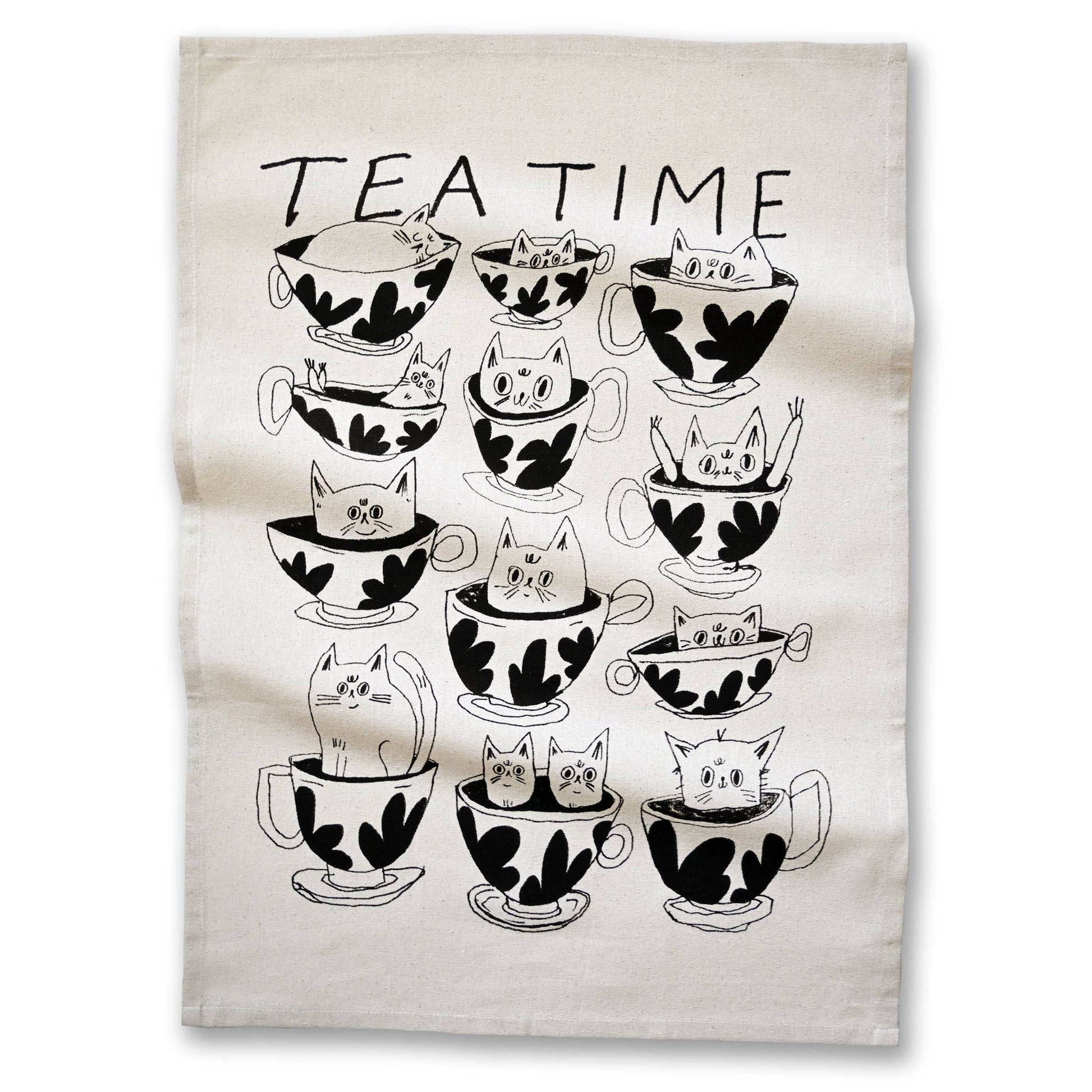 Tea towel with black and white illustrations of cats in teacups and 'TEA TIME' text.