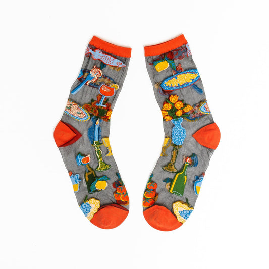 Pair of socks with colorful designs on a white background