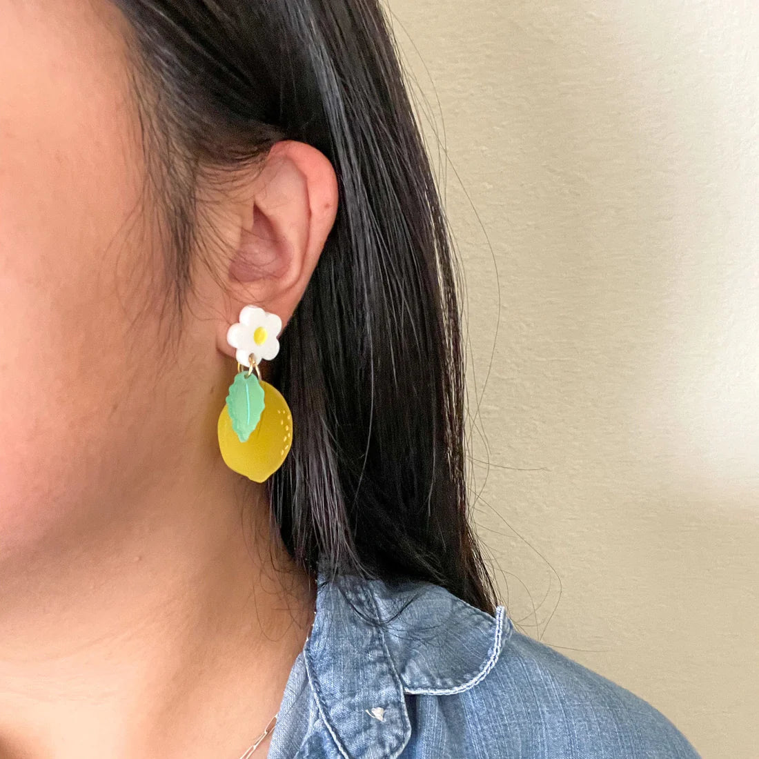 lemon daisy earrings worn for scale 