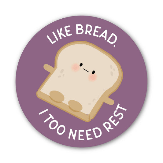 A round sticker with a purple background, a cute slice of bread character in the center, and the text “LIKE BREAD. I TOO NEED REST” in white around the illustration.