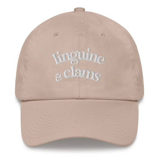Beige cap with 'linguine & clarus' text on a white background