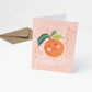 baby shower card with an orange illustration and text on an orange background