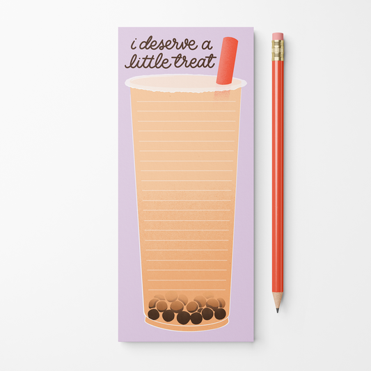 A lavender notepad with a lined bubble tea drawing and the text 'i deserve a little treat' next to a red pencil on a white background.