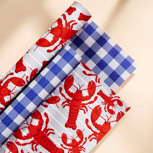 double sided gift wrap -- one side is blue gingham and the other has red lobsters 