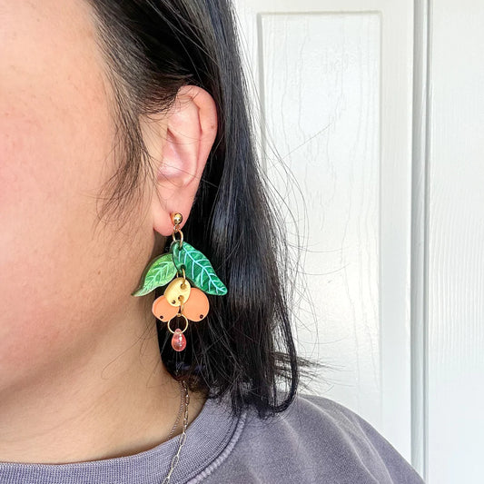 Loquat dangle earrings for scale 