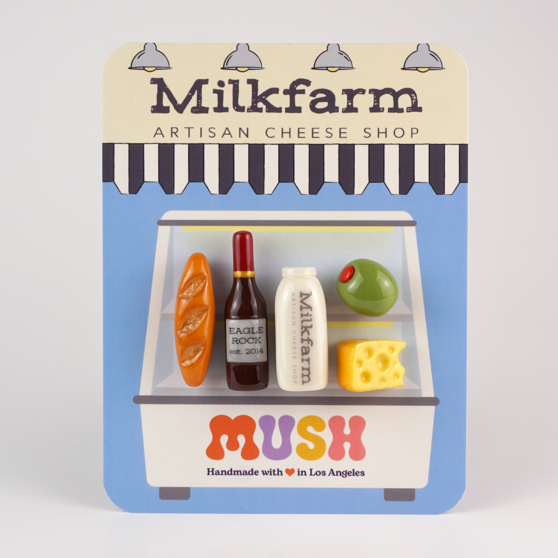 Packaged magnet cheese set with 'Milkfarm' branding on a white background