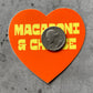 Macaroni & Cheese Sticker shown with 25 cent coin for size comparison.