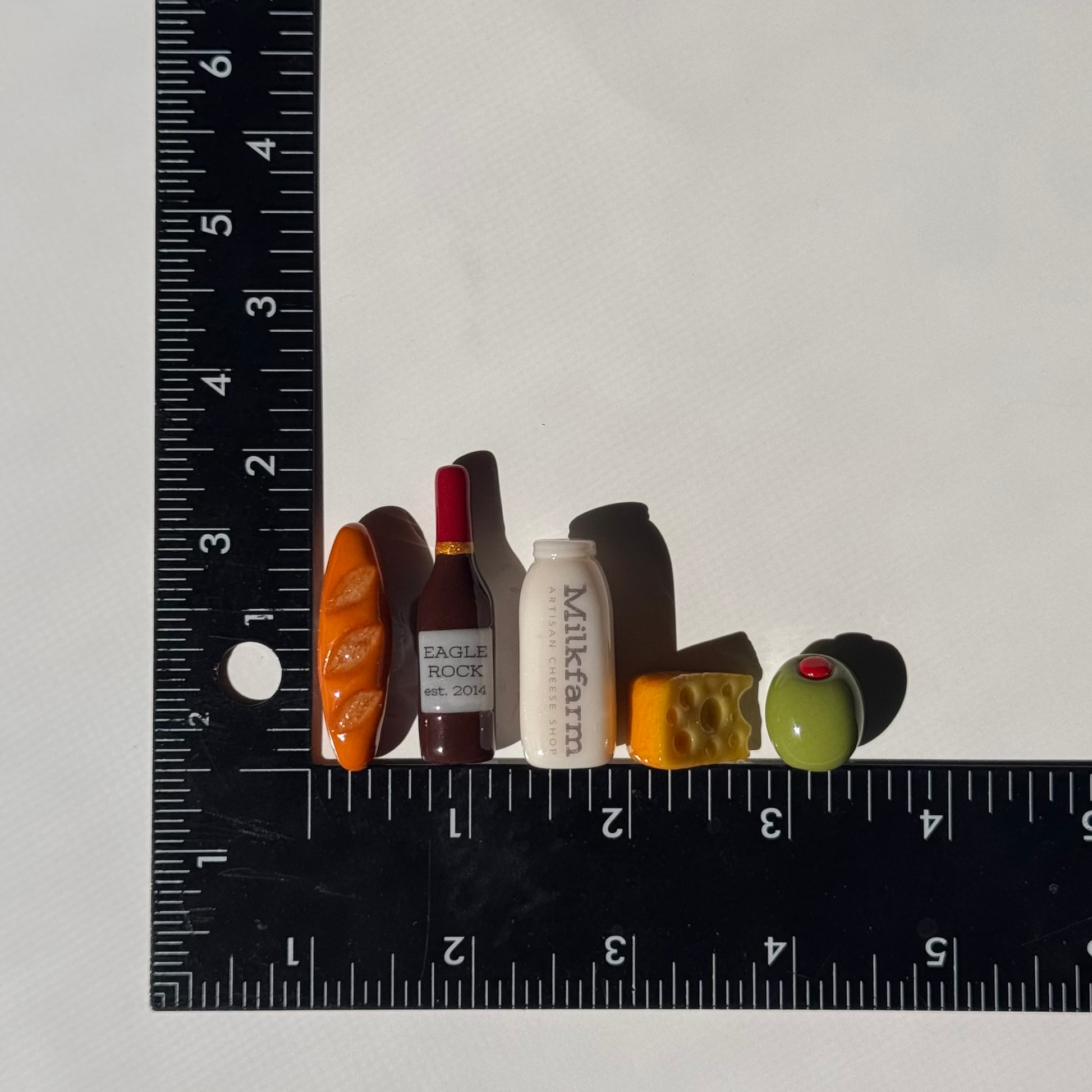 Mini magnets against a ruler to show the size detail.