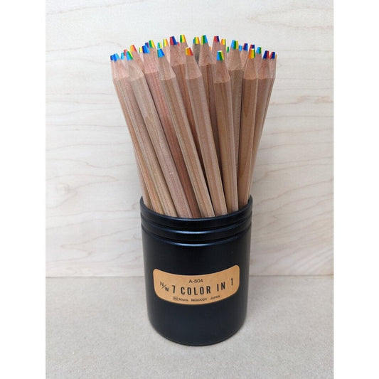 Black cylinder of pencils holding 60 7-color multicolor pencils. Pencil holder is labeled "N/W 7 Color in 1"